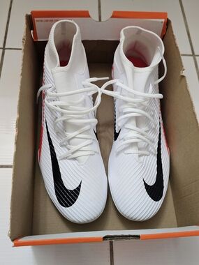 Nike White Mid-Top Soccer Cleats with Black Swoosh